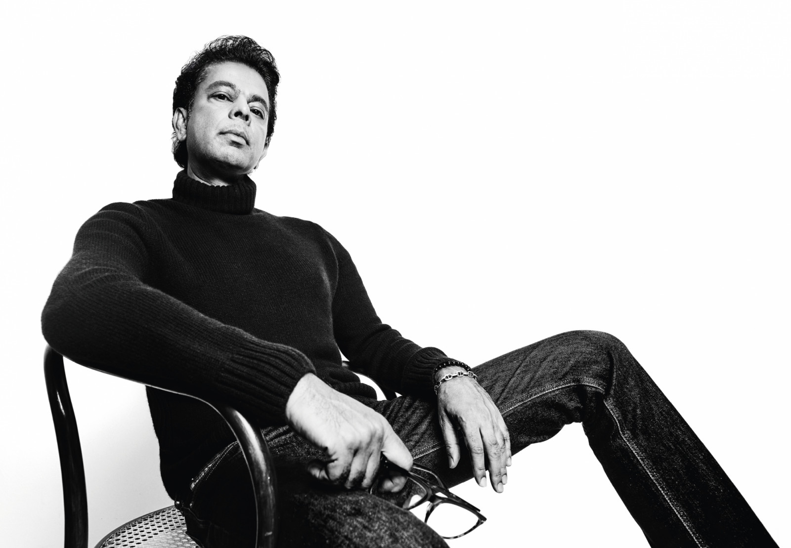Loro Piana turtleneck;
Anurag’s own denim
jeans, bracelets;
stylist’s own glasses