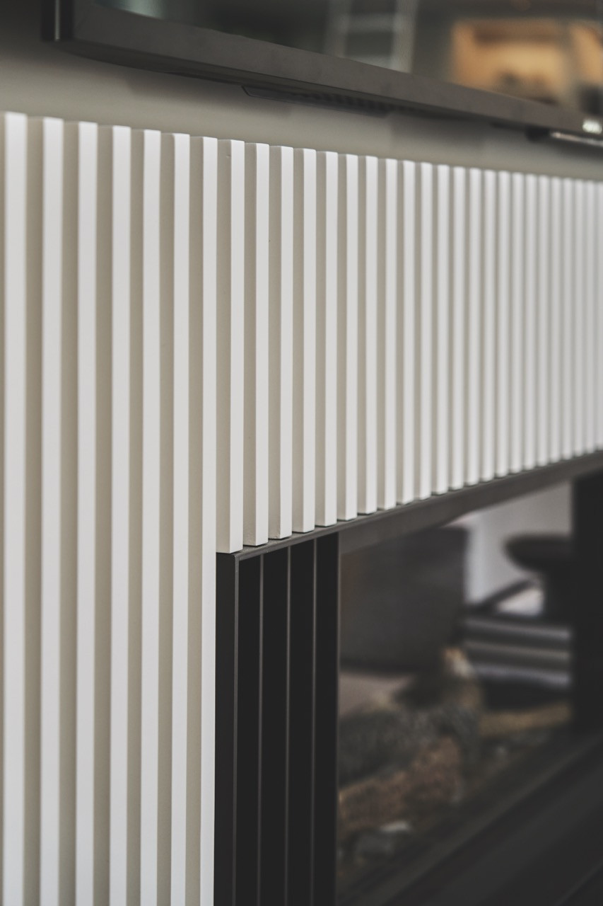 The home’s bespoke detailing relies on material quality and clean lines rather than ornamental features