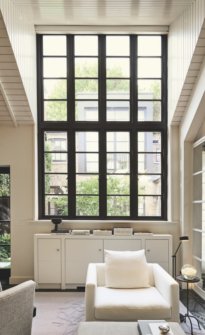 The home office’s towering Crittall window maximises the natural light crucial to the building’s original purpose as an artist’s studio