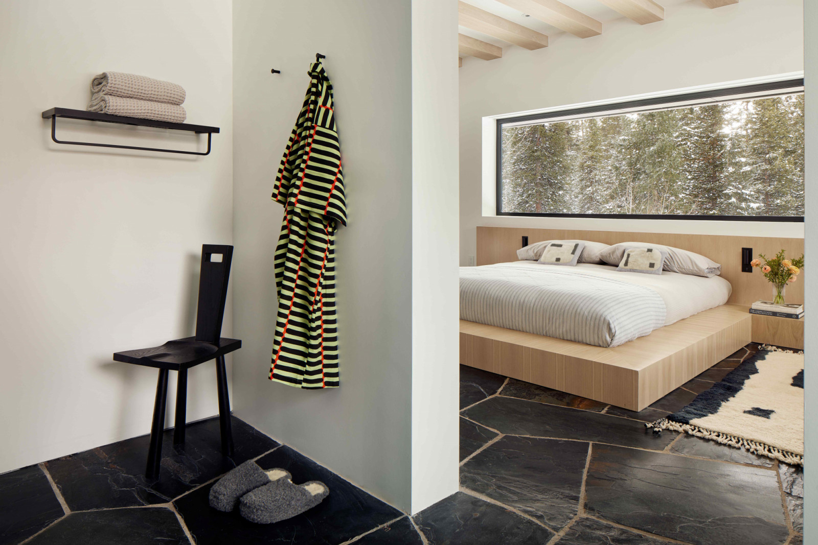 Slate flagstone flooring blends the domestic spaces with the surrounding landscape