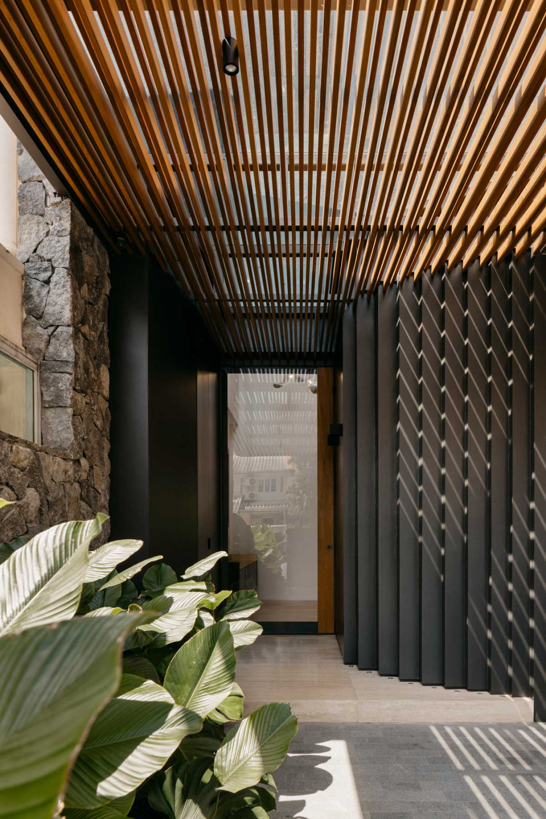 A striking entrance fabricated by 4Plus8 for Armo Design Studio