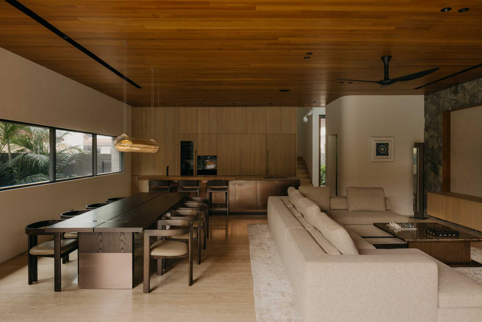 A minimalist yet inviting dining and living area by 4Plus8 and Armo Design Studio
