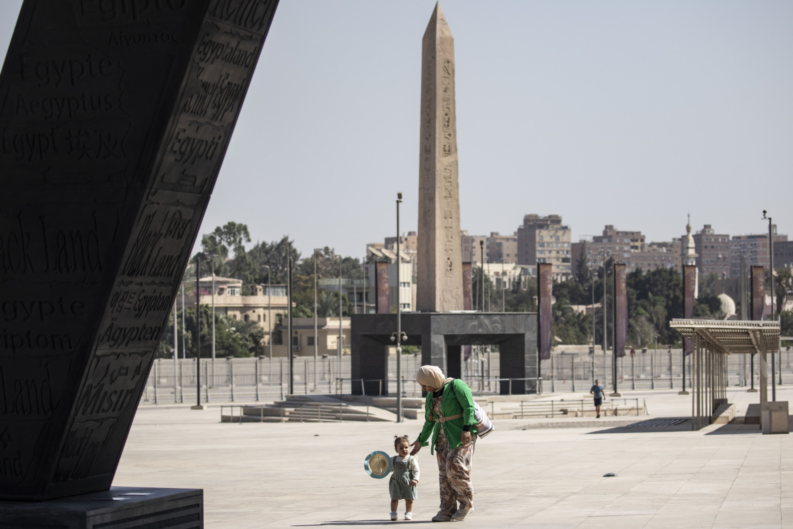 15 October 2024, Egypt, Giza: A visitors walks in front of the "hanging obelisk" of Ramesses II at the entrance to the Grand Egyptian Museum (GEM) in Giza. A partial soft opening of the Grand Egyptian Museum will start on Wednesday, October 16, with a trial operation for the museum's main hall and a gradual operation of some other sections in preparation for the grand official opening. Photo: Gehad Hamdy/dpa (Photo by Gehad Hamdy/picture alliance via Getty Images)
