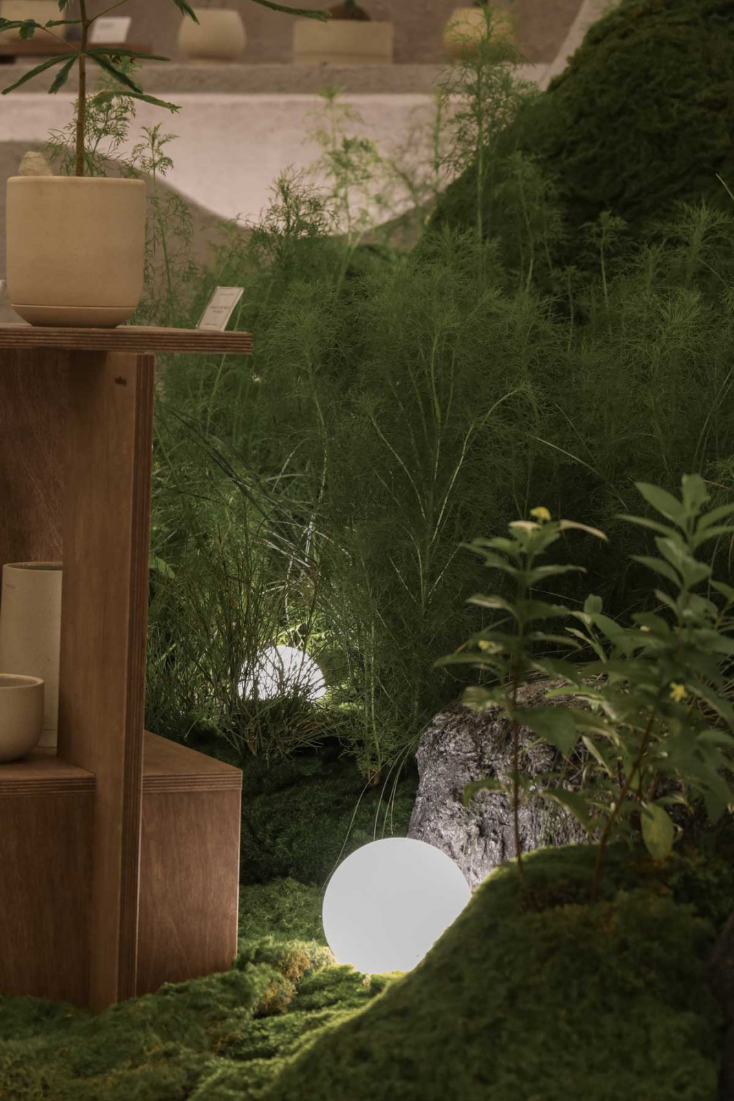 Glowing spheres lend a poetic quality to this garden presentation by Soilboy