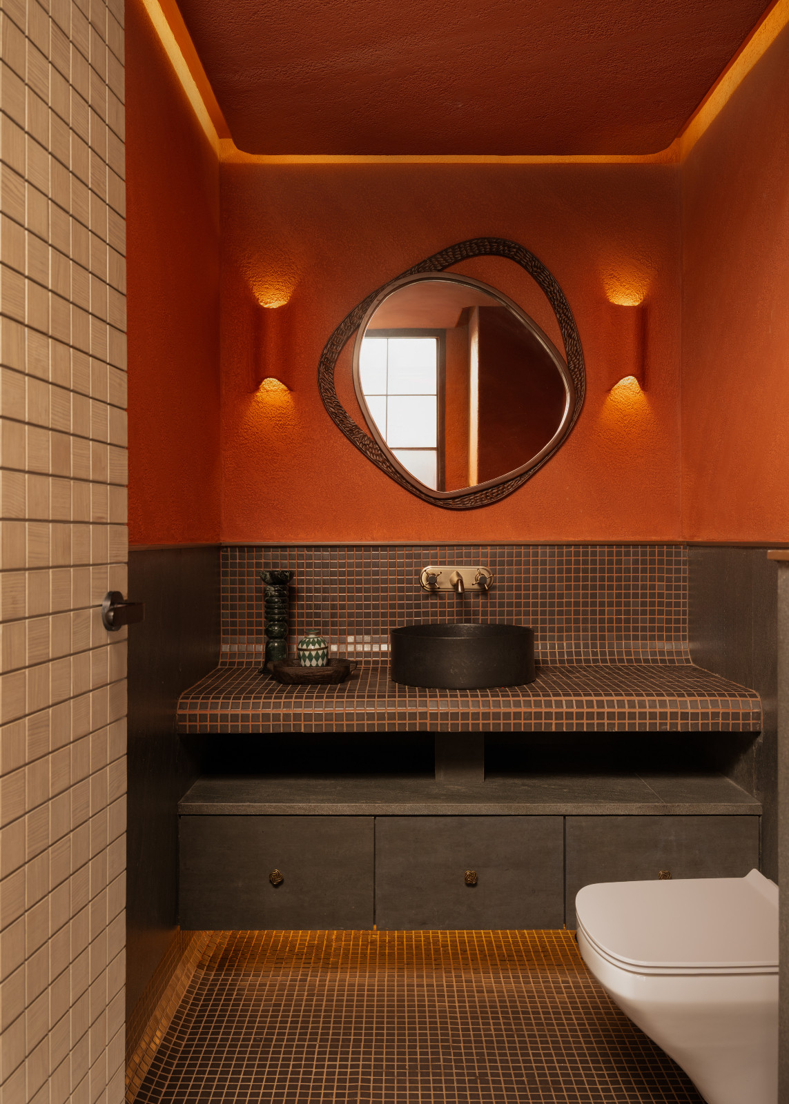 The powder room in a Mumbai, India home by Pill Design Studio