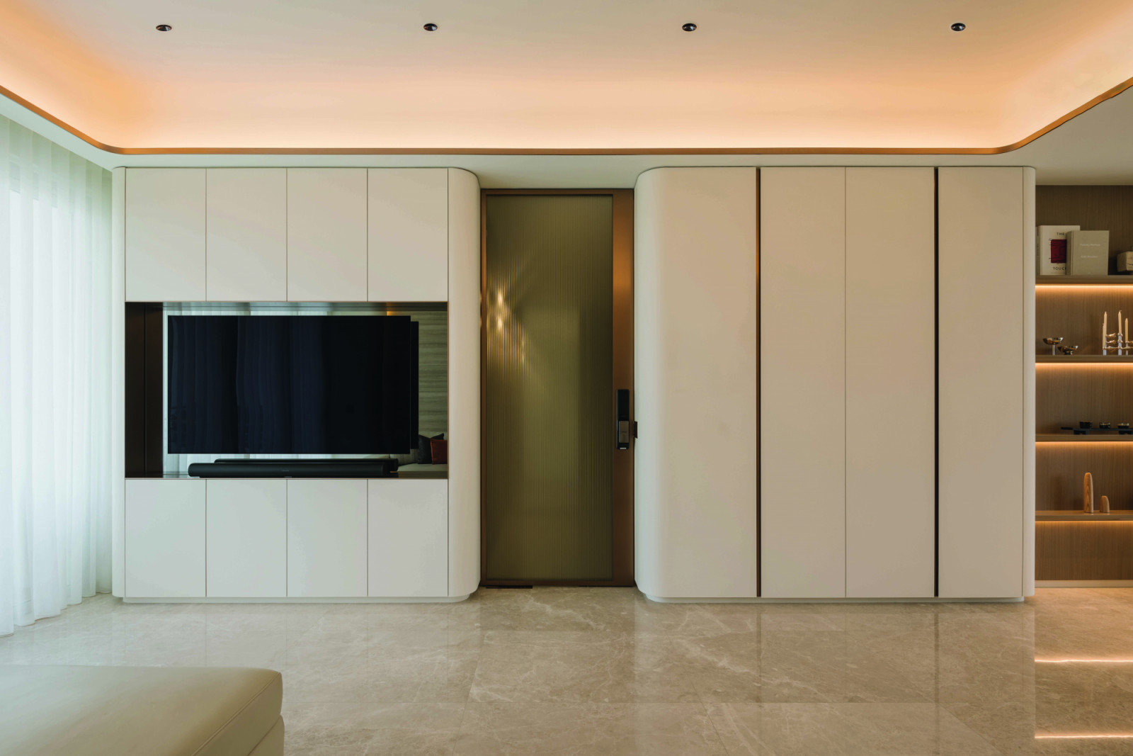 The living space features plenty of storage options, beautifully incorporated into the overall design
