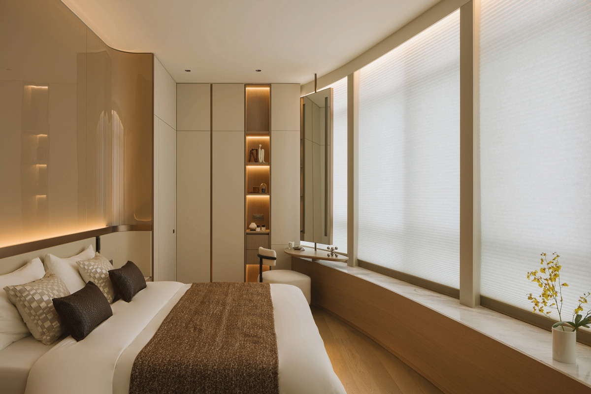 The Newton One apartment’s master bedroom is an at-home oasis replete with tonal beiges and light browns that create a restful air