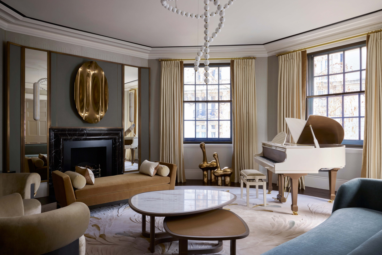 The living bedroom of a home in London's OWO Residences, designed by Deseesion Interiors and featuring Fromental's Rain wallcovering