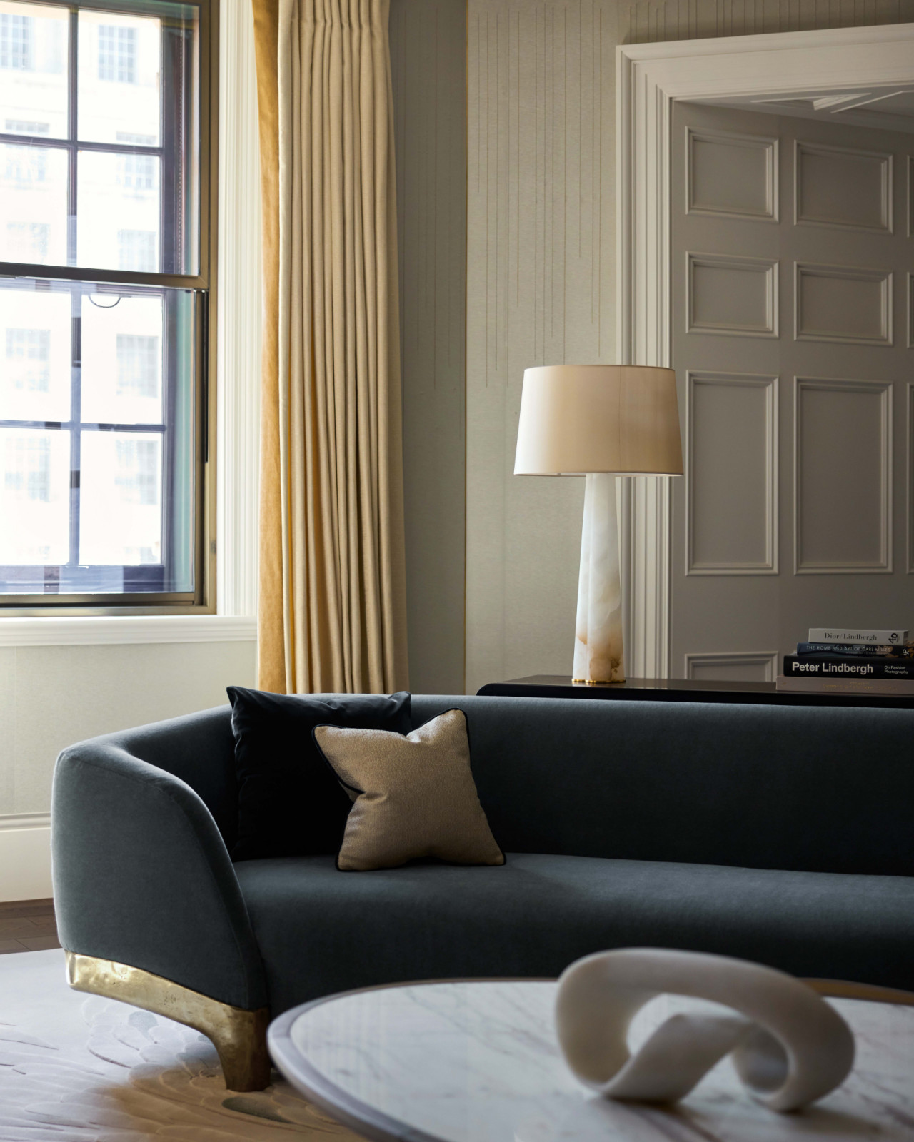 The living bedroom of a home in London's OWO Residences, designed by Deseesion Interiors and featuring Fromental's Rain wallcovering