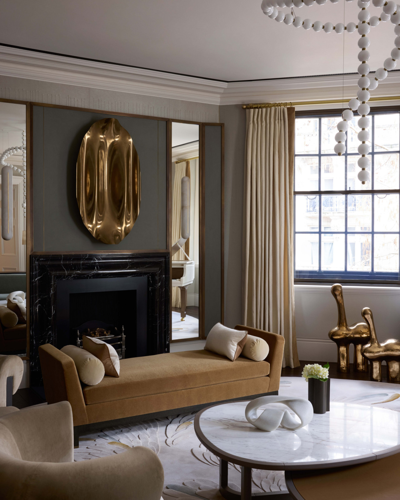 The living bedroom of a home in London's OWO Residences, designed by Deseesion Interiors and featuring Fromental's Rain wallcovering