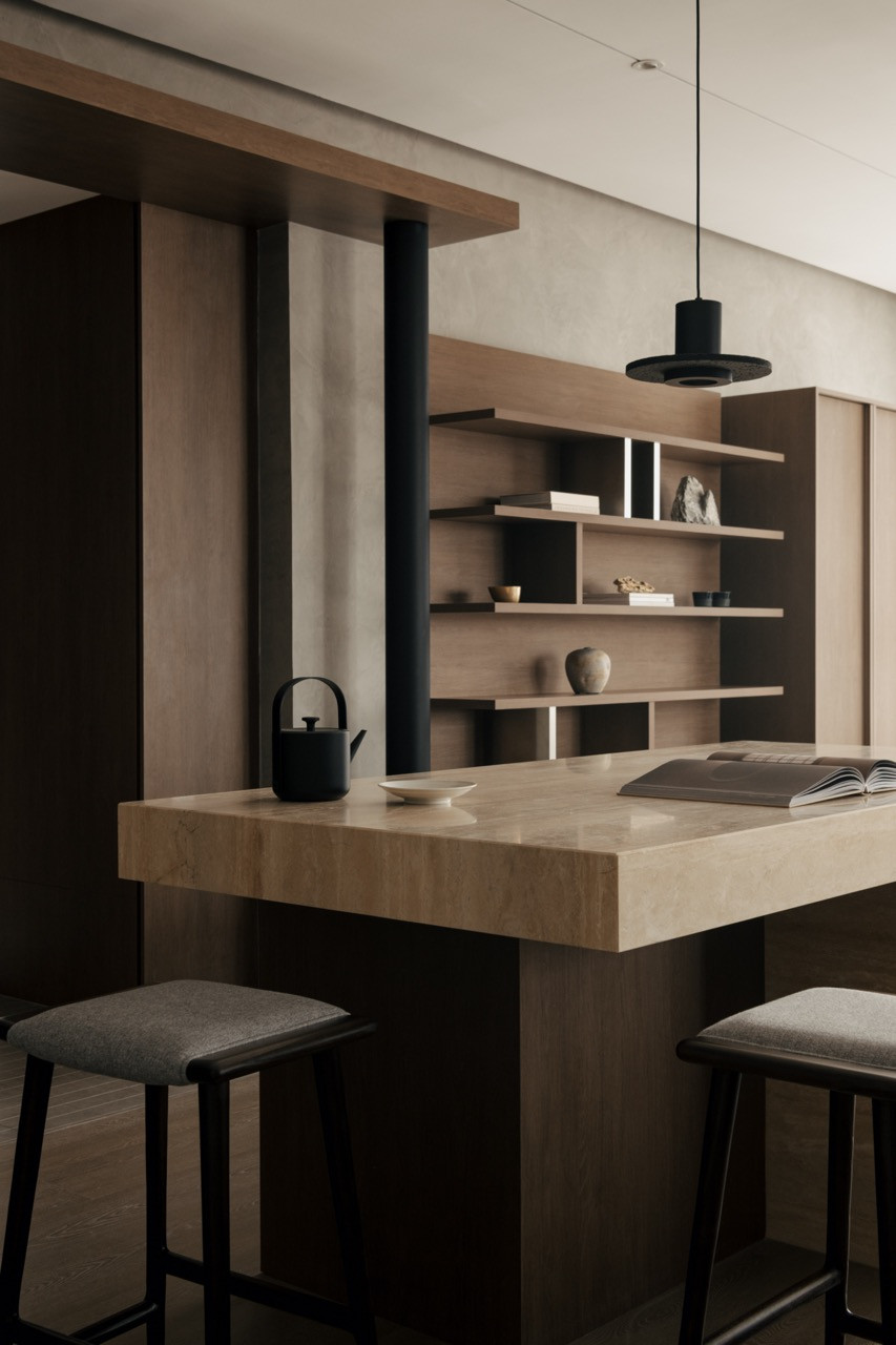 The counter island's oak shelving provides storage whilst maintaining visual connections across the Japanese-inspired apartment
