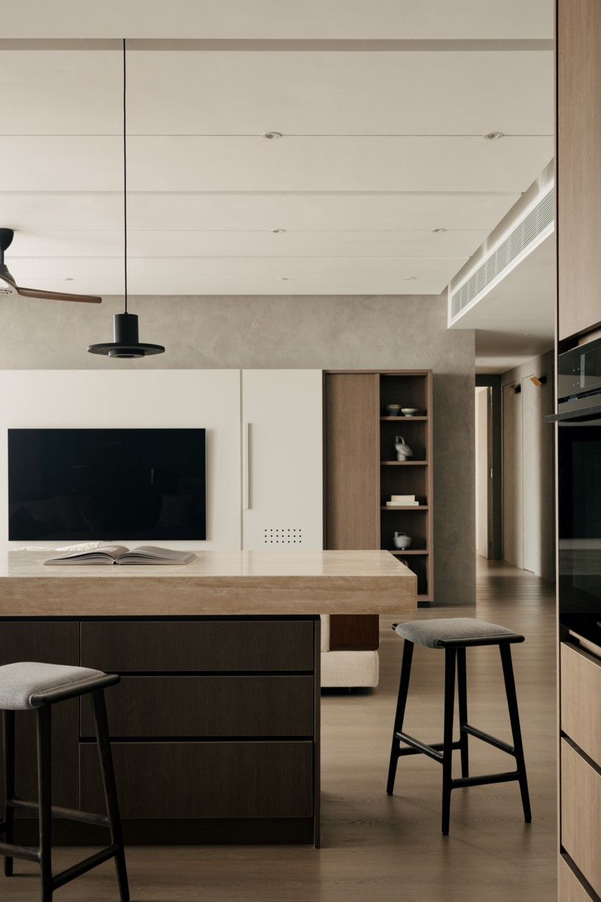 The kitchen island, with its torii-inspired opening, provides sightlines from the dining area directly into the cooking space