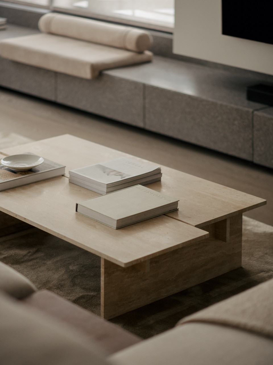 The pine coffee table sits in the living area, one of the warm wood elements in Wuuu Studio's material scheme