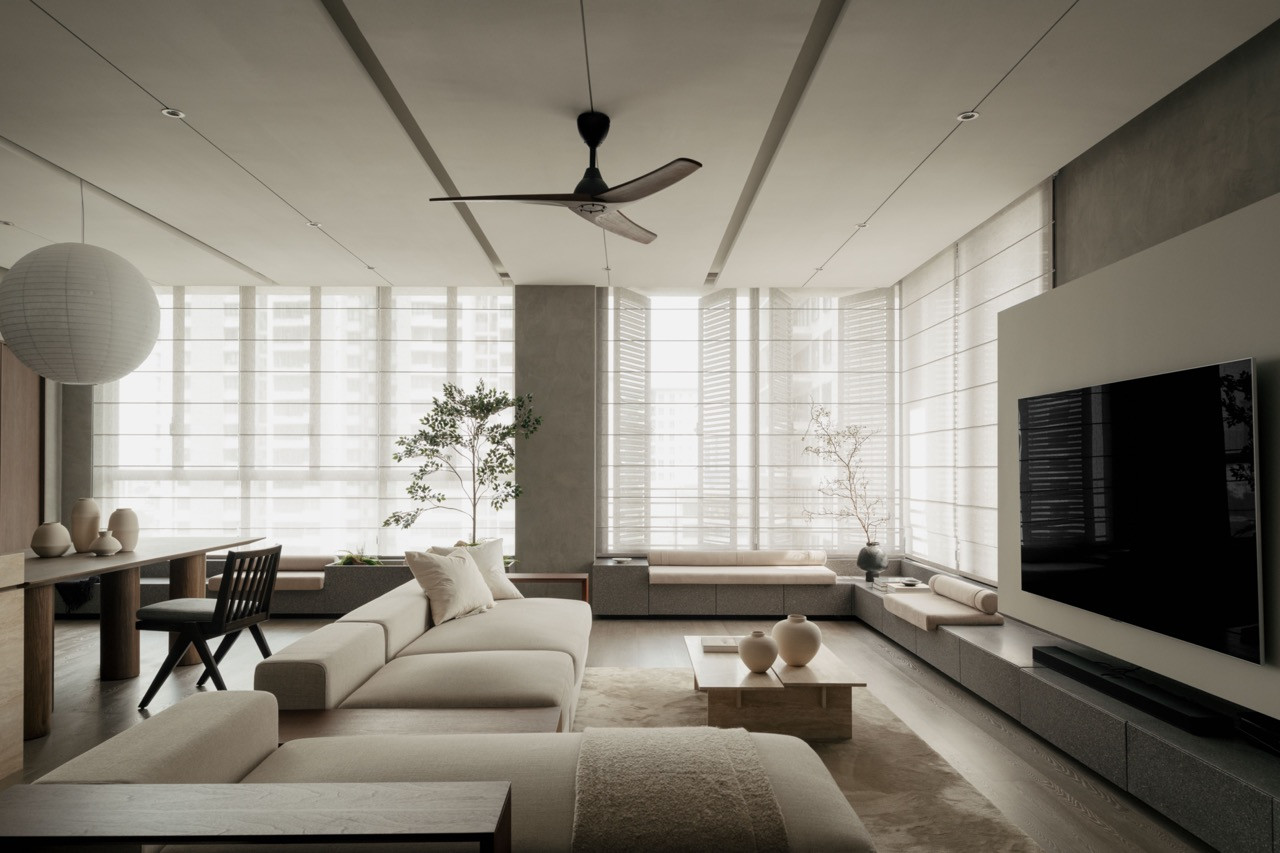 The extended living area, gained by removing the balcony, accommodates generous seating and the cement structural column