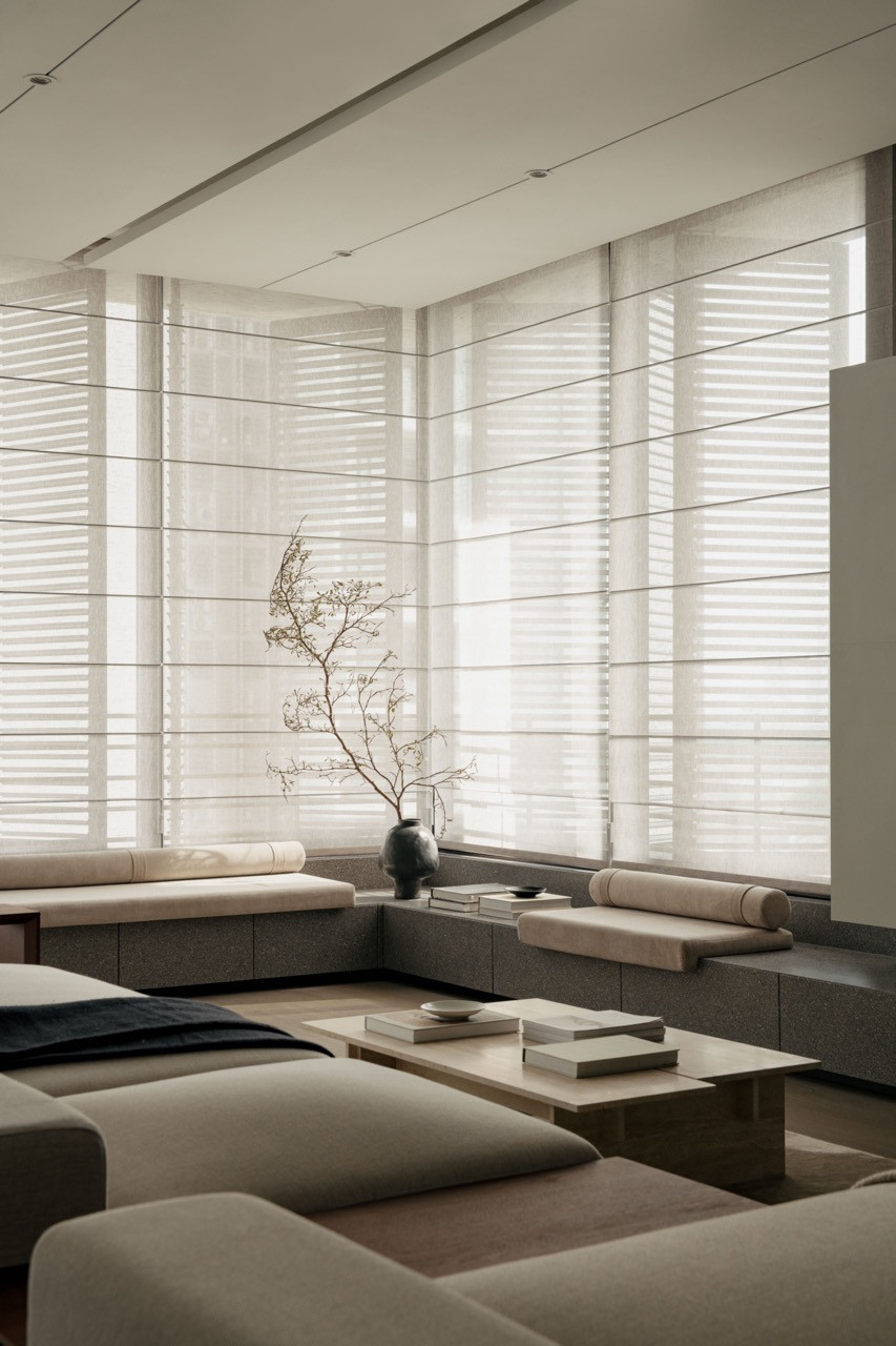 The window benches run along the perimeter where the original balcony was removed to expand the living space