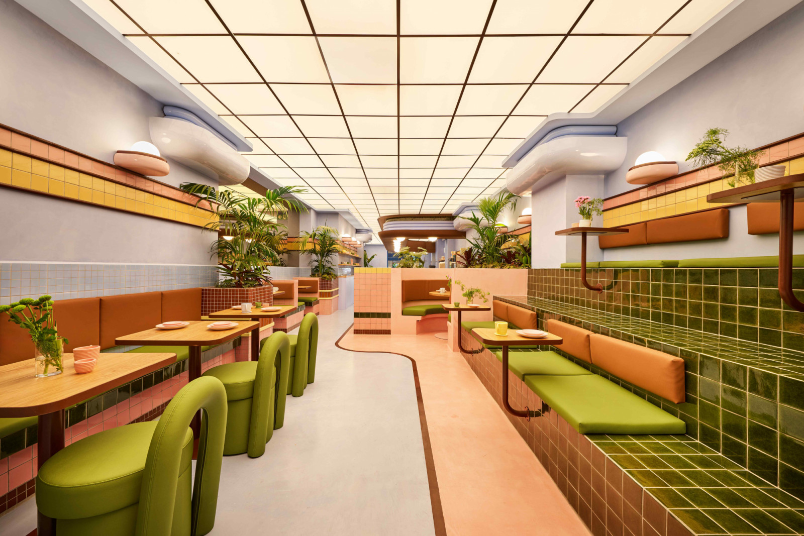 The theatrical gelato café is a playful exercise in colour, curve, and material juxtaposition
