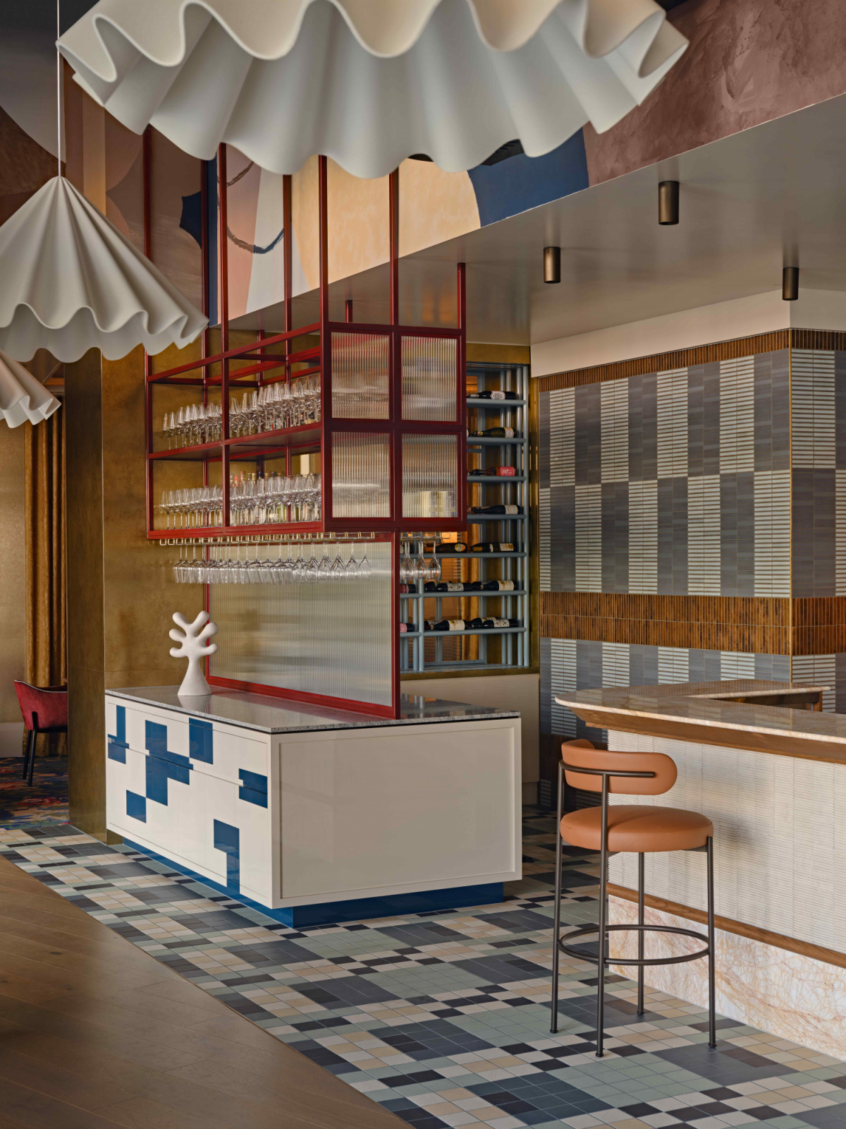 Soft, low-hung pendants carefully layered to create pools of warmth