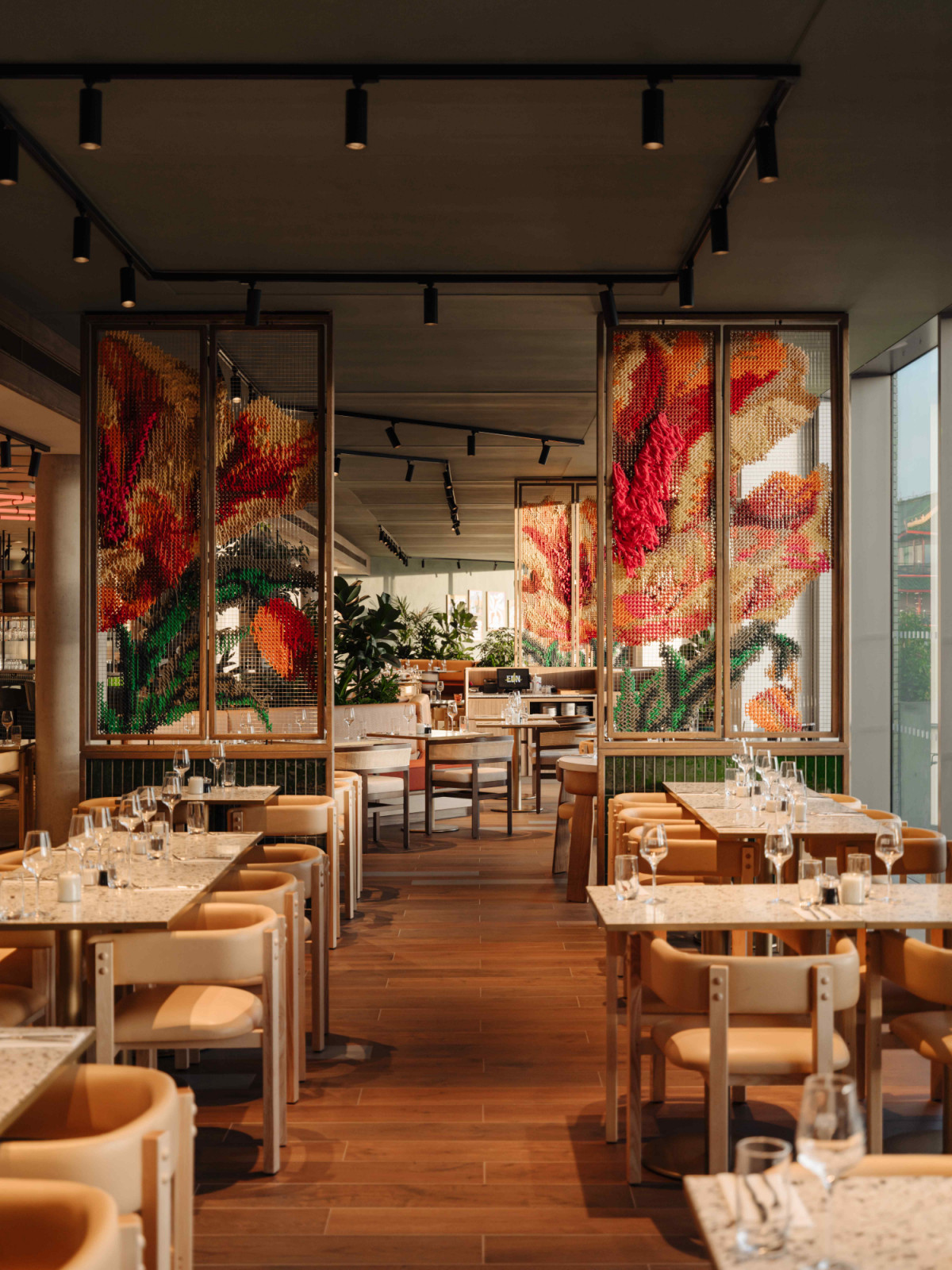 Natural timbers and woven textures create a sense of warmth within the vibrancy