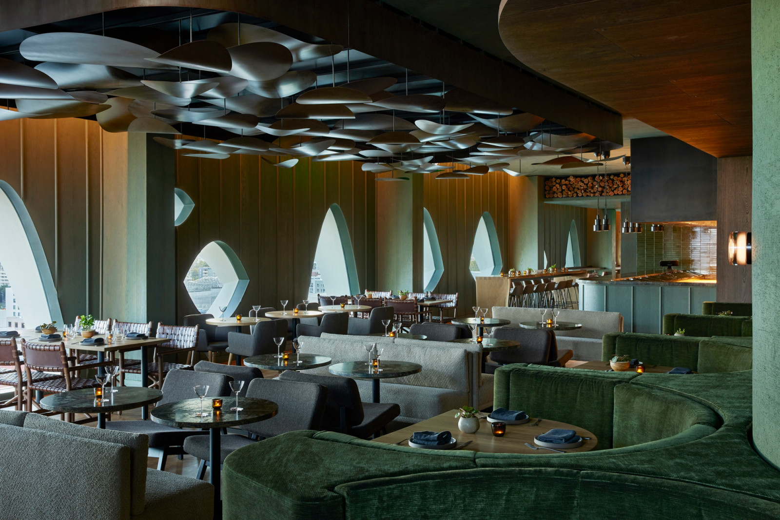 Saturated greens, warm golds, and tactile timber evoke the changing seasons