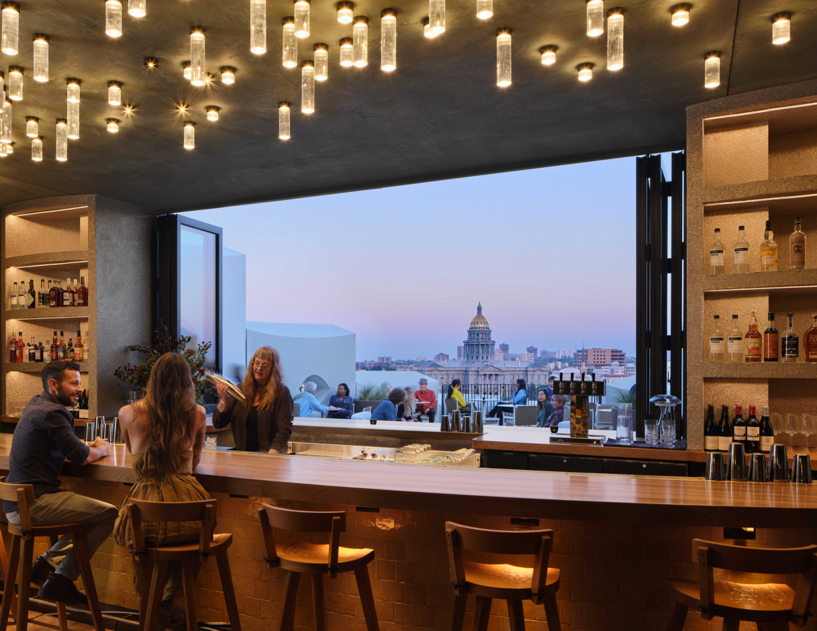 The large window frames city views, while modulating daylight and heat gain
