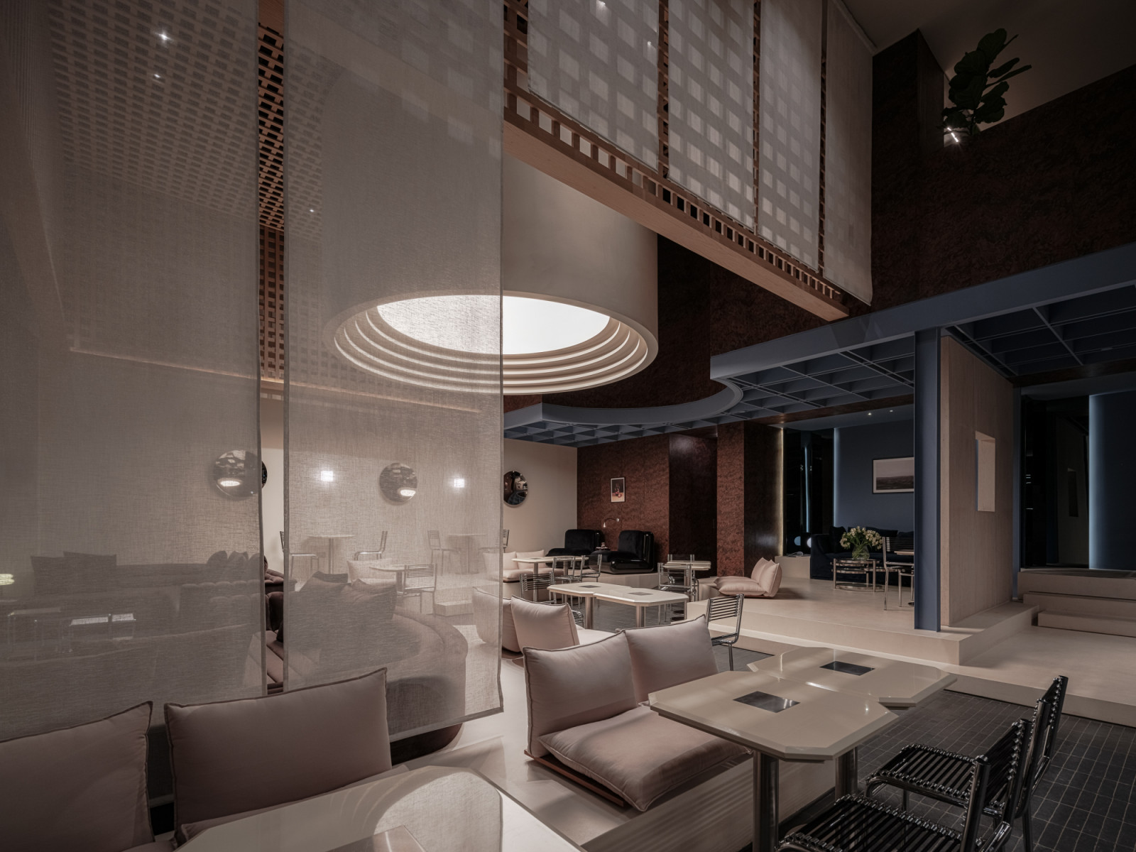 Varied seating typologies allow the space to serve different party sizes with equal grace