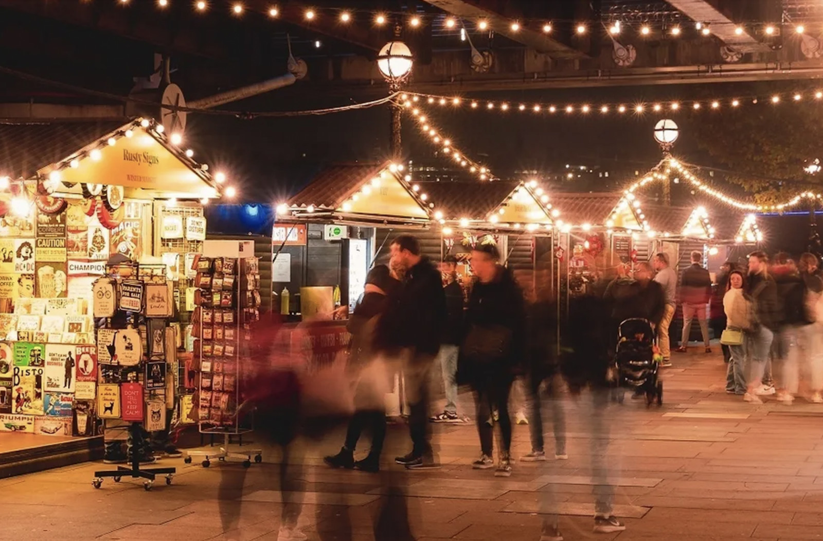 Southbank Centre Winter Market lines the Thames with wooden chalets serving festive food, drinks, and handmade gifts. (Photo: Southbank London)