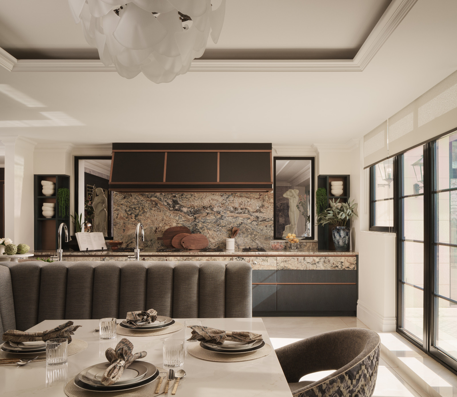 The muted, textural elements of the kitchen and dining area in a Hertfordshire, England property designed by Vastu Interior Design to include elements of Vastu Shastra, India's ancient architectural science