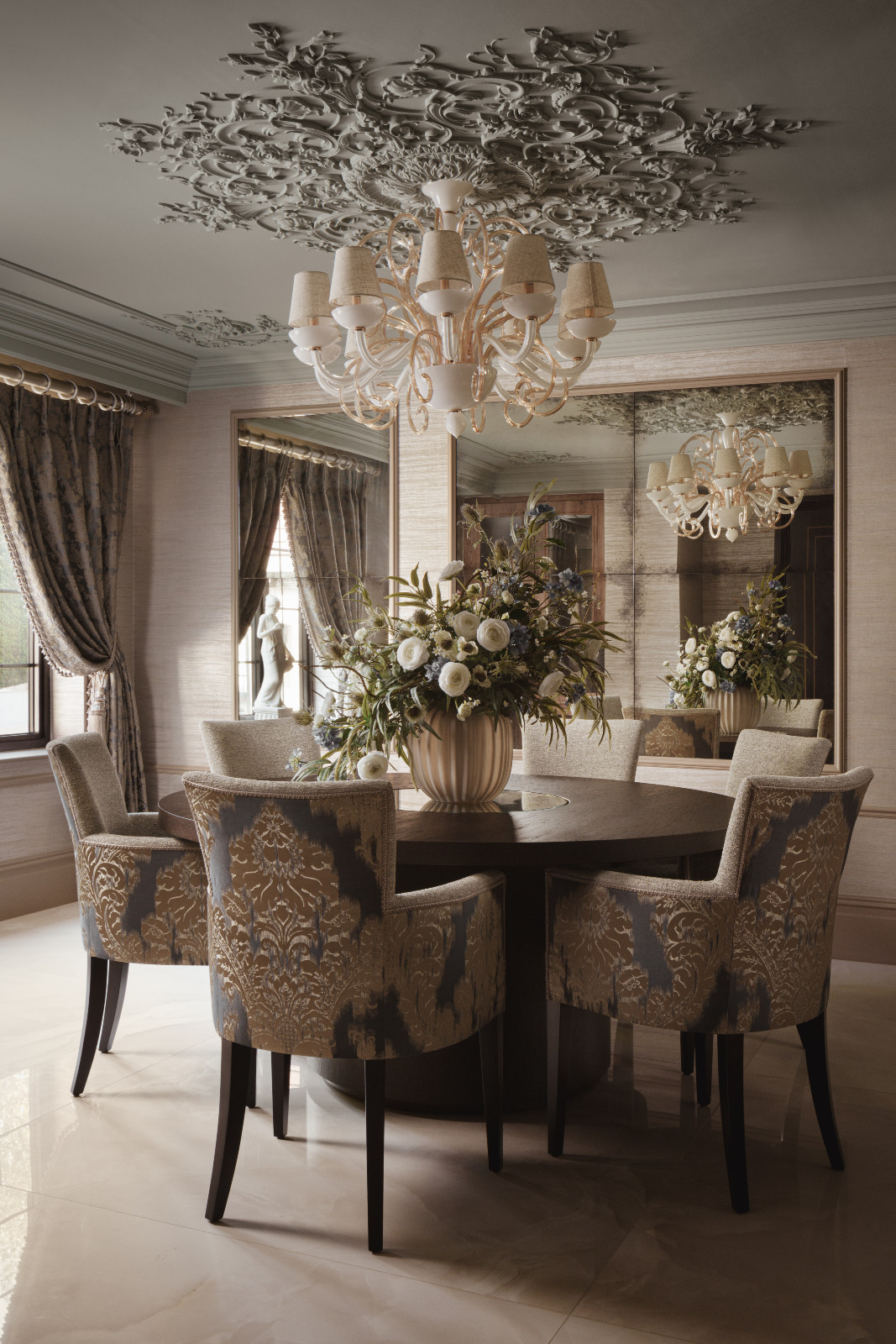 The muted, textural elements of the kitchen and dining area in a Hertfordshire, England property designed by Vastu Interior Design to include elements of Vastu Shastra, India's ancient architectural science