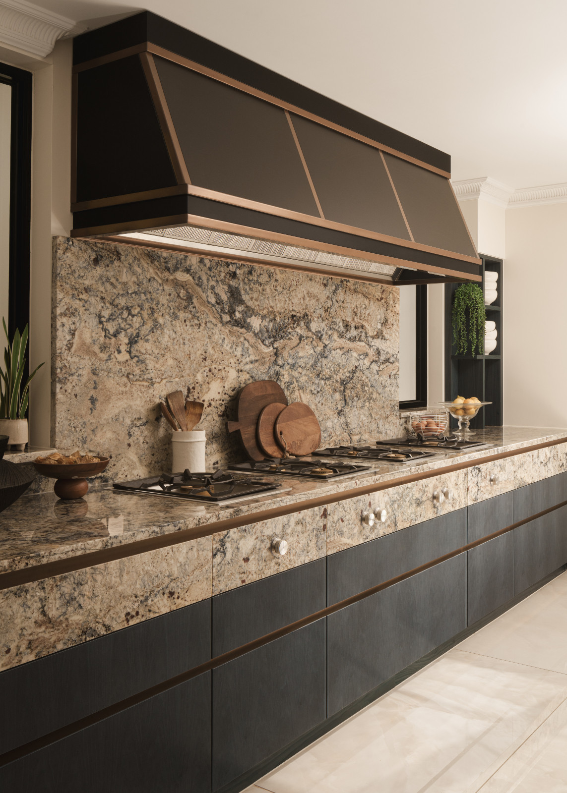 The muted, textural elements of the kitchen in a Hertfordshire, England property designed by Vastu Interior Design to include elements of Vastu Shastra, India's ancient architectural science