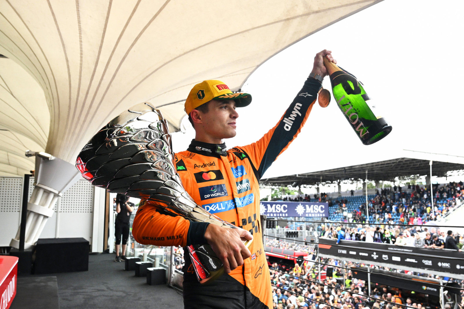 SAO PAULO, BRAZIL - NOVEMBER 09: Race winner Lando Norris of Great Britain and McLaren with his trophy on the podium during the F1 Grand Prix of Brazil at Autodromo Jose Carlos Pace on November 09, 2025 in Sao Paulo, Brazil. (Photo by Mark Sutton - Formula 1/Formula 1 via Getty Images)