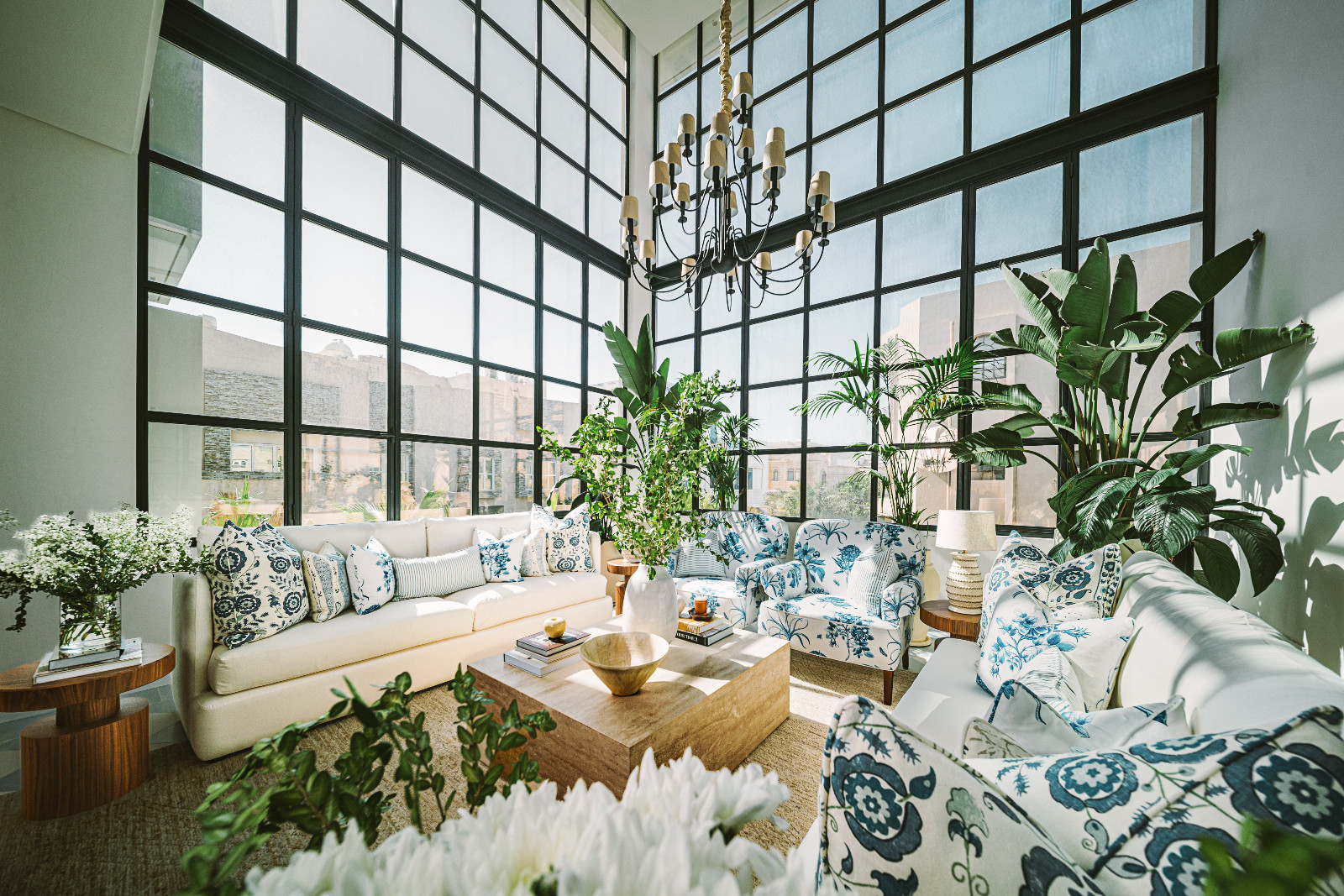A terrace transformed into a lush conservatory by Qreative Design Studio at a family home in Muharraq, Bahrain