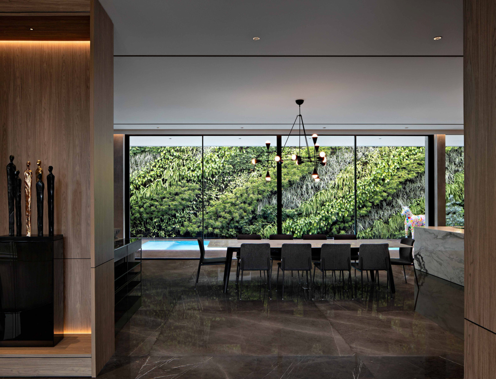 The Pondok Indah home’s backyard is occupied by a lap pool and a massive vertical garden that itself almost like an artwork