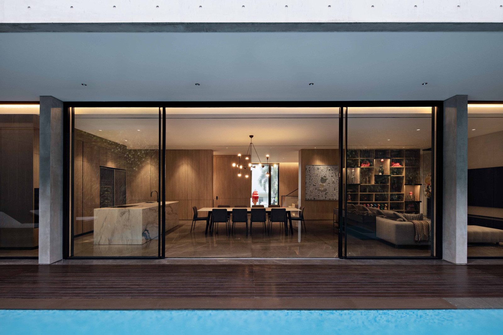 View of the Pondok Indah home’s living and dining area from the pool