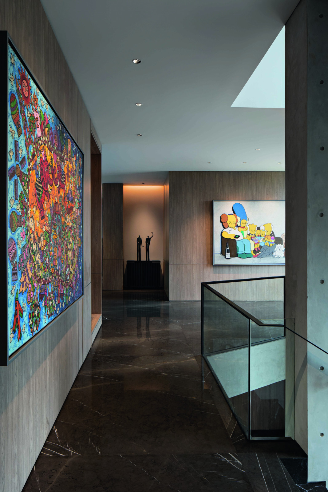 The sculptures and paintings adorning the house are expertly lit by Litac