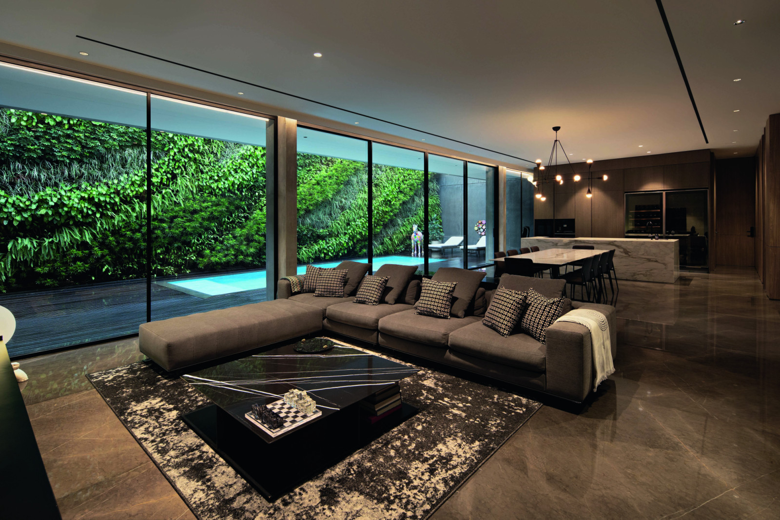 The living area’s marble floor is one of the few reflective surfaces in the home, a deliberate choice to let the artworks shine