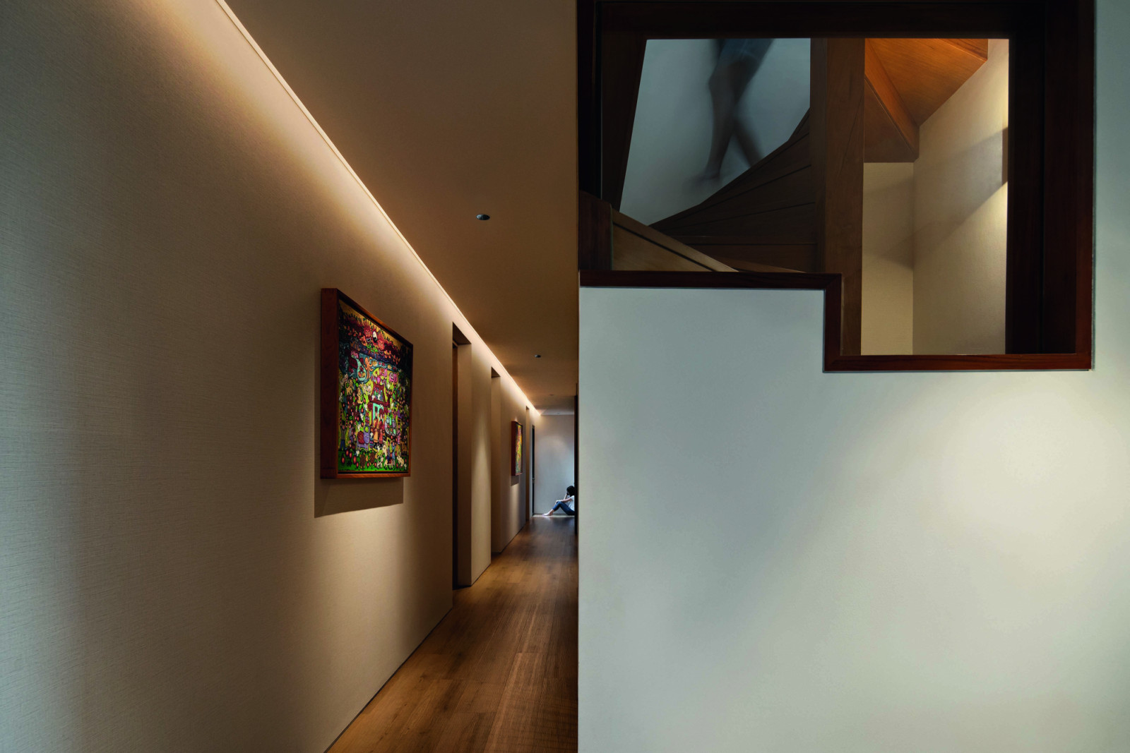 The double-loaded corridor to the bedrooms is envisioned as a luxury hotel lobby, dotted with art, while the staircase to the roof features openings to facilitate delightful visual moments