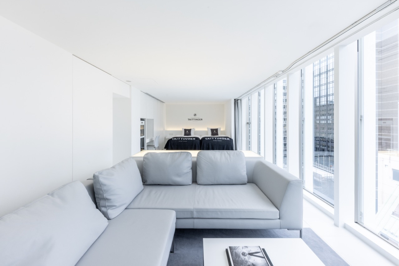 An open-plan suite demonstrates the building’s clean architectural lines