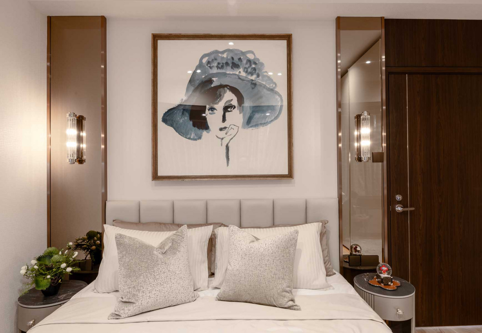 A whimsical artwork sets a grand yet playful tone in this bedroom