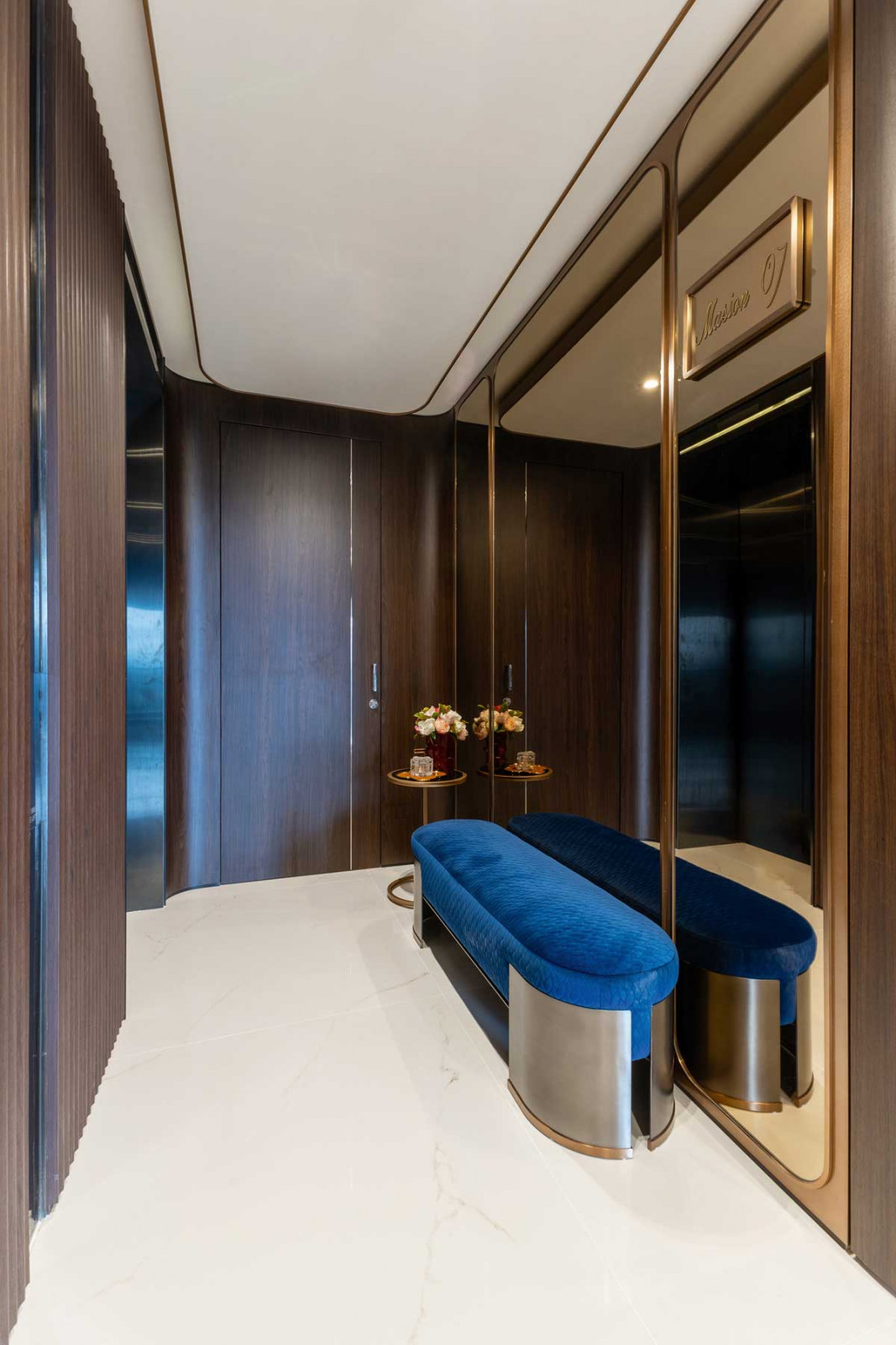 The hotel-style foyer sets the tone for the interiors
