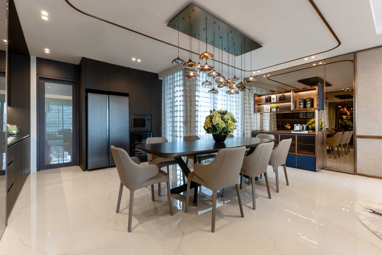 Anchored by a custom-length Cattelan Italia table, the dining area exudes understated opulence