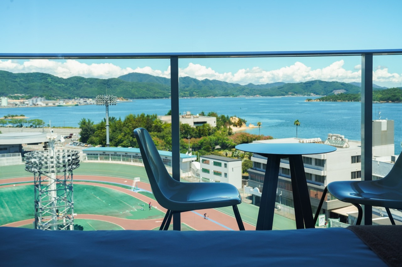 Suite terrace overlooking Tamano Keirin Stadium and the Seto Inland Sea