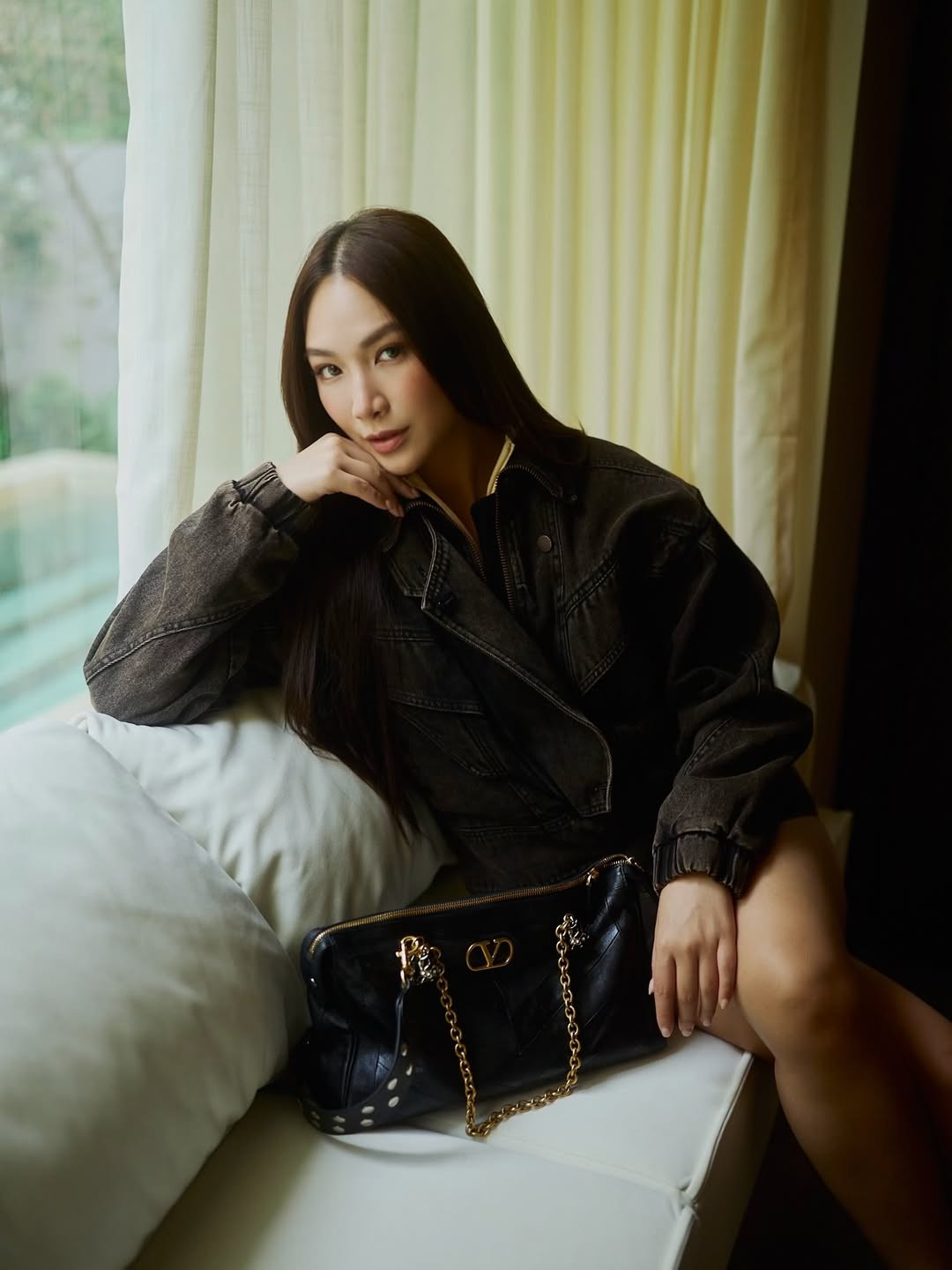 Jane Lau carries the Valentino Panthea Bag.