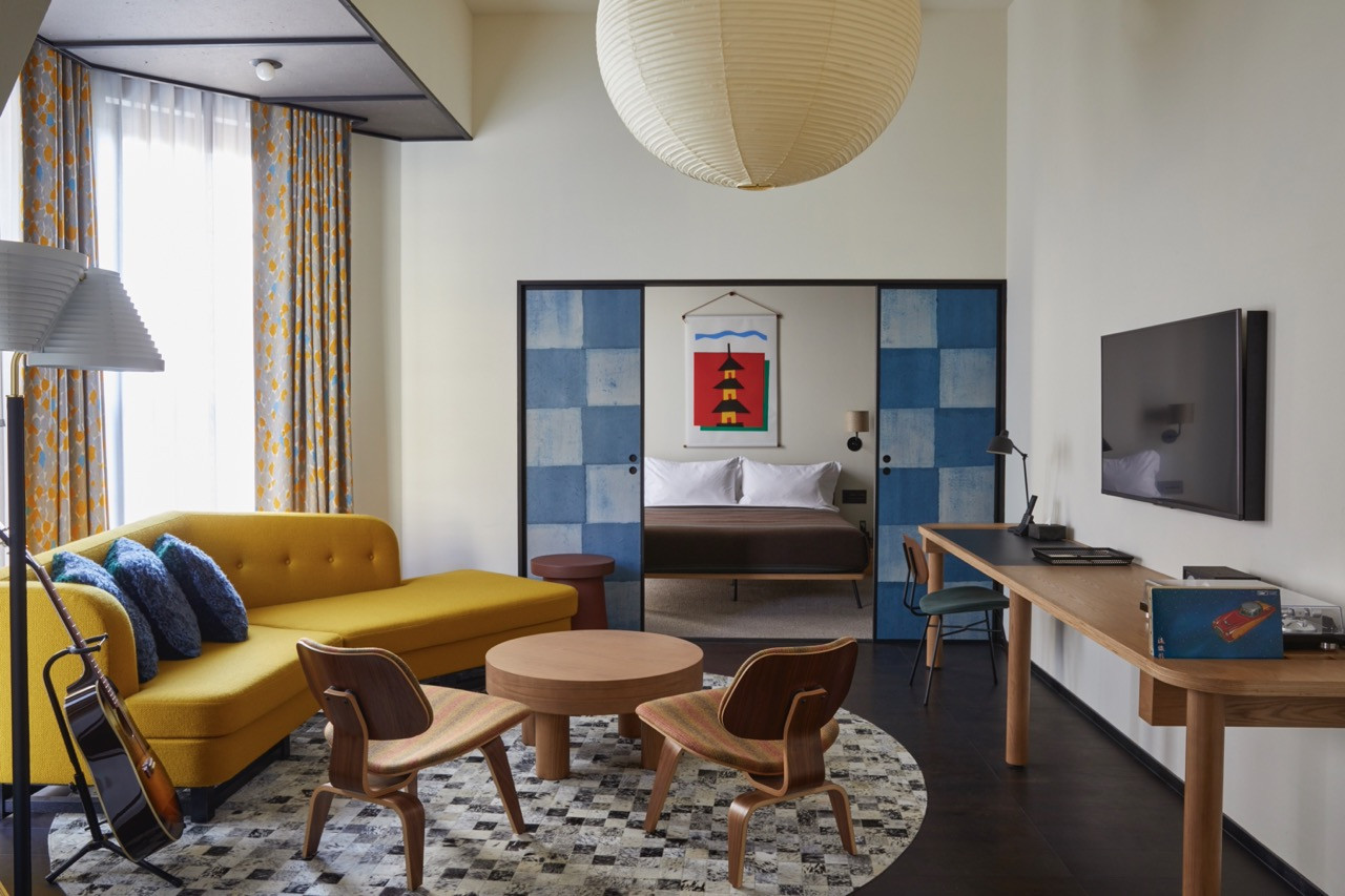 Suite interiors feature furniture by American and European designers alongside Kyoto craft elements and combine Western-style accommodation with Japanese textile work.