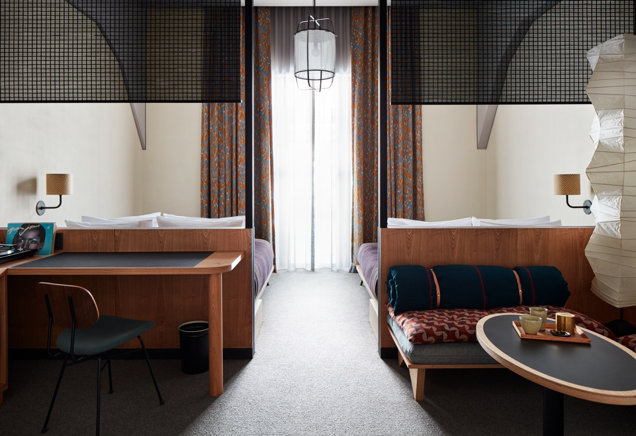 Paper lanterns by a 200-year-old maker, Kobayashi-type, and copper fixtures by the traditional workshop Kanaami Tsuji appear throughout the hotel