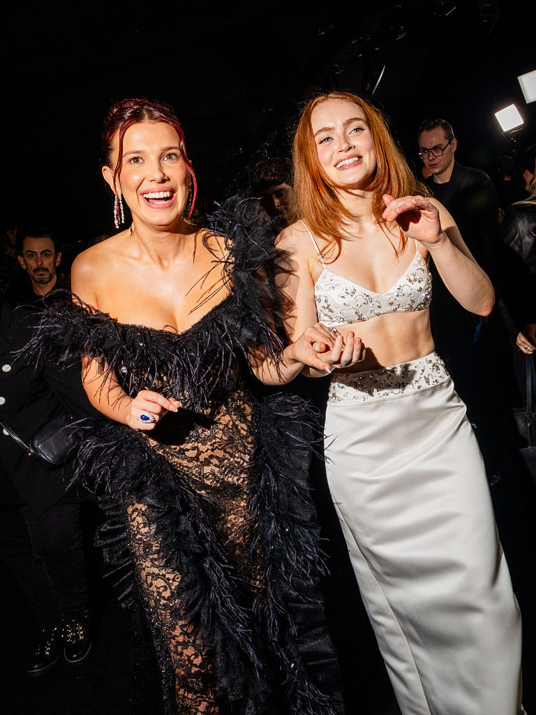 HOLLYWOOD, CALIFORNIA - NOVEMBER 06: (L-R) Millie Bobby Brown and Sadie Sink attend Netflix's "Stranger Things" Season 5 World Premiere at TCL Chinese 6 Theatres on November 06, 2025 in Hollywood, California. (Photo by Roger Kisby/Getty Images for Netflix)