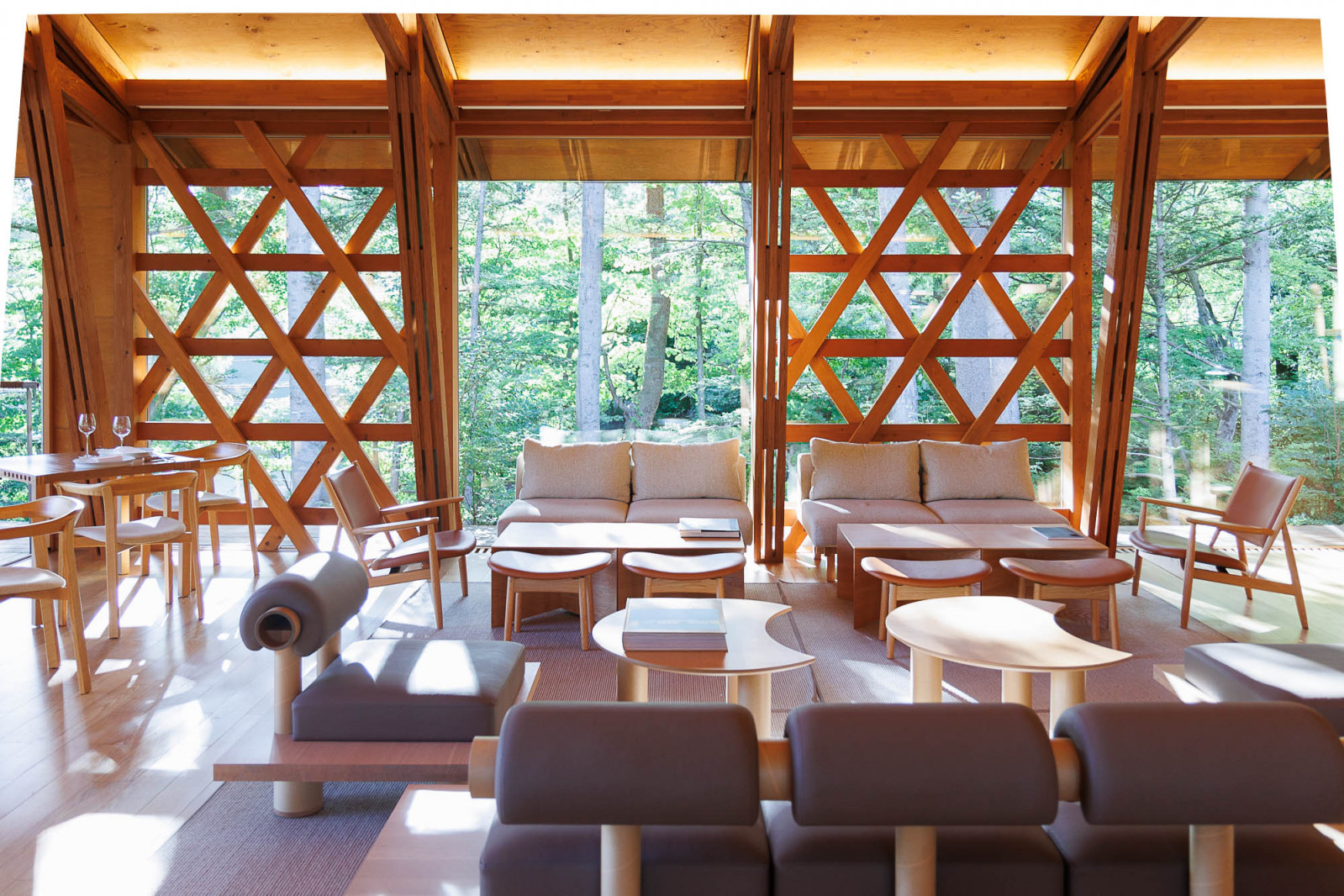 Shi-shi-iwa’s restaurant, Shola, is located in SSH No.02 and features floor-to-ceiling timber-framed glass doors that connect interior spaces to the landscape