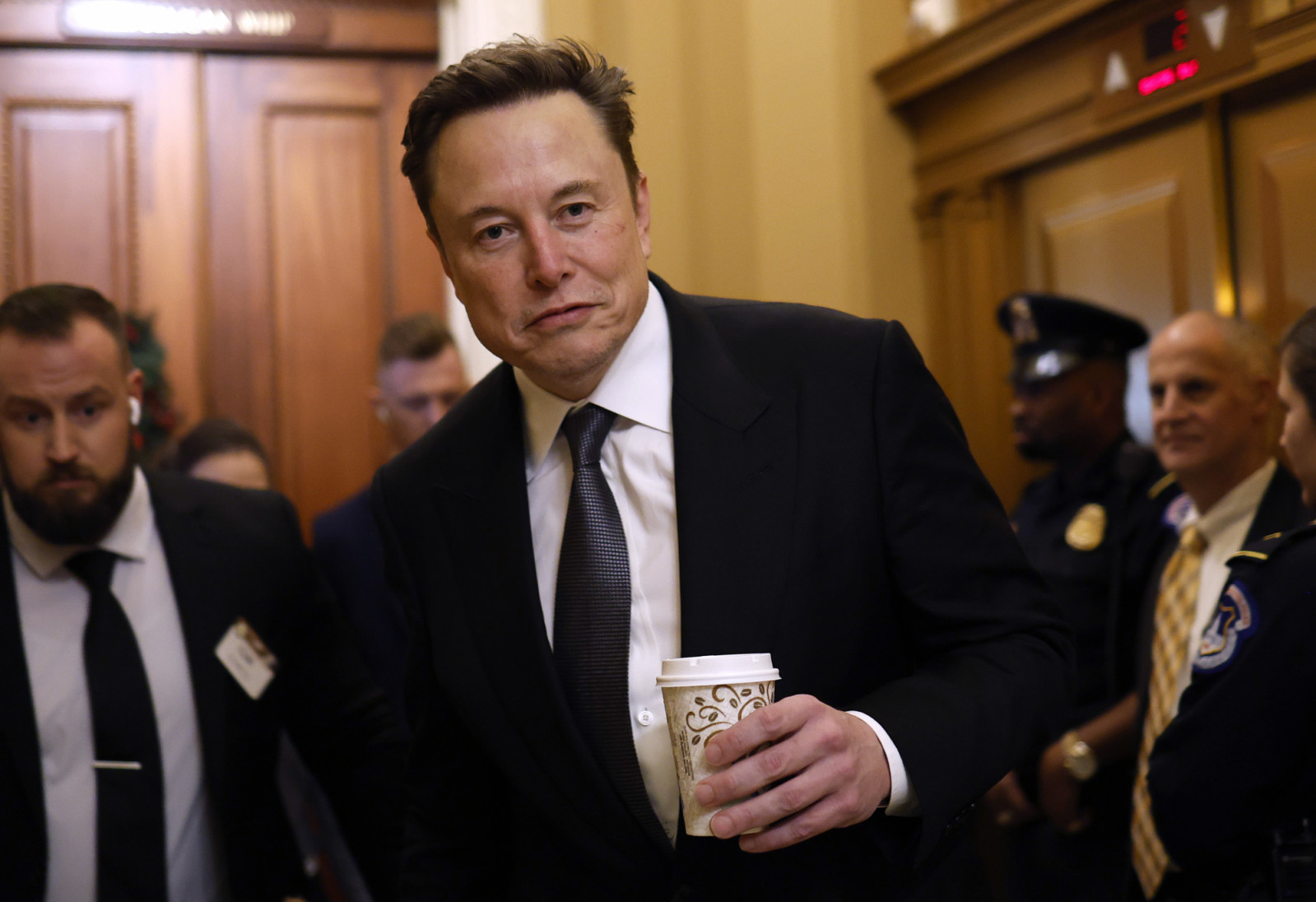 WASHINGTON, DC - DECEMBER 05: Tesla CEO Elon Musk, Co-Chair of the newly announced Department of Government Efficiency (DOGE), arrives on Capitol Hill on December 05, 2024 in Washington, DC. Musk and his Co-Chair, businessman Vivek Ramaswamy are meeting with lawmakers today about DOGE, a planned presidential advisory commission with the goal of cutting government spending and increasing efficiency in the federal workforce. (Photo by Anna Moneymaker/Getty Images)