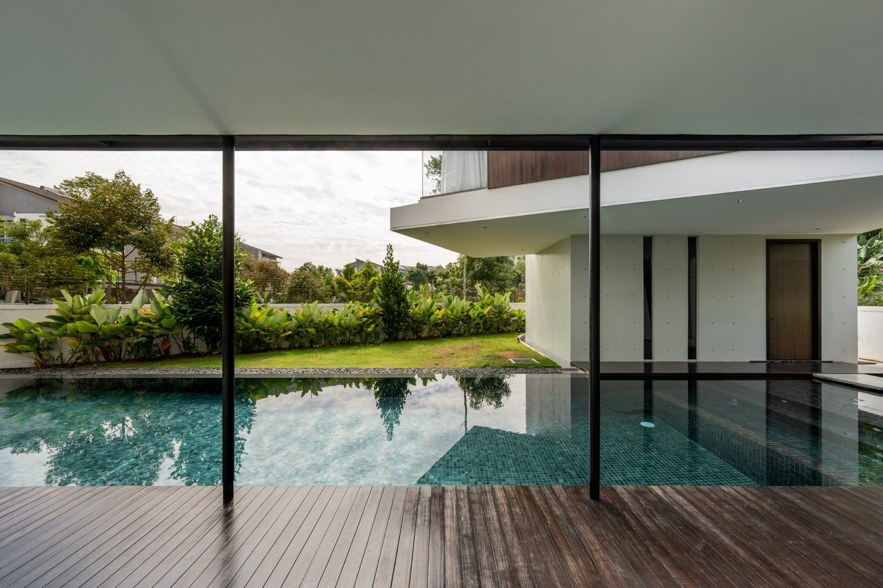 The covered walkway creates a transitional space between indoor and outdoor areas