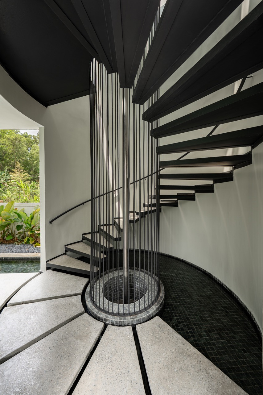 The black metal spiral staircase connects the pavilion levels