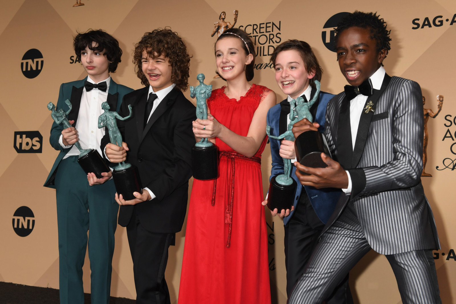 LOS ANGELES, CA - JANUARY 29: (L-R) Actors Finn Wolfhard, Gaten Matarazzo, Millie Bobby Brown, Noah Schapp and Caleb McLaughlin, winners of the Outstanding Ensemble in a Drama Series award for 'Stranger Things', pose in the press room during the 23rd Annual Screen Actors Guild Awards at The Shrine Expo Hall on January 29, 2017 in Los Angeles, California. (Photo by Jeff Kravitz/FilmMagic)